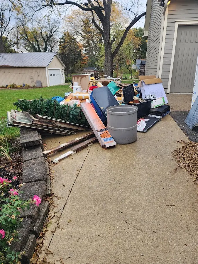 Dumpster being loaded with debris for Residential Dumpster Rental in Long Beach